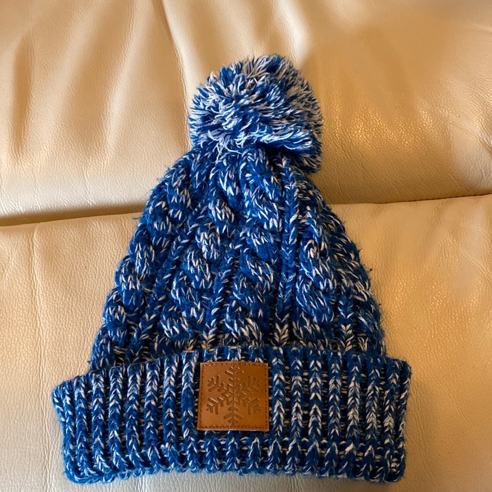 Blue hat with snowflake logo on the front